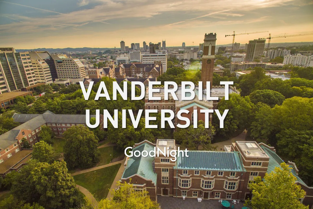A sweeping view of Vanderbilt University, featuring its distinctive buildings, the iconic clock tower, and lush green trees, set against the Nashville city skyline. The image captures the collegiate atmosphere and vibrant outdoor campus life.